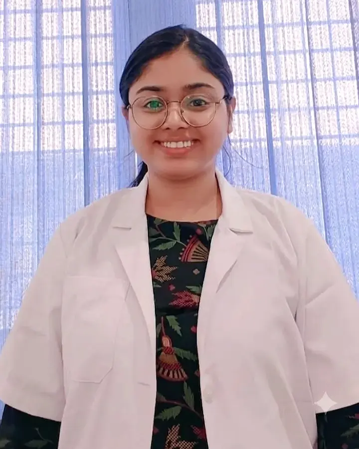 Dr. Shivali Srivastava, BDS Oral and Dental Surgeon, wearing her white coat at her dental clinic in Patel Nagar, Varanasi